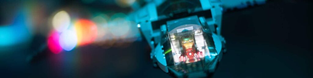 Lego iron man flying plan in dark|A man sprays gas on a beach||||||GCP|AWS|The Alibaba Cloud Service Logo|Iron Man flies a plane in the dark